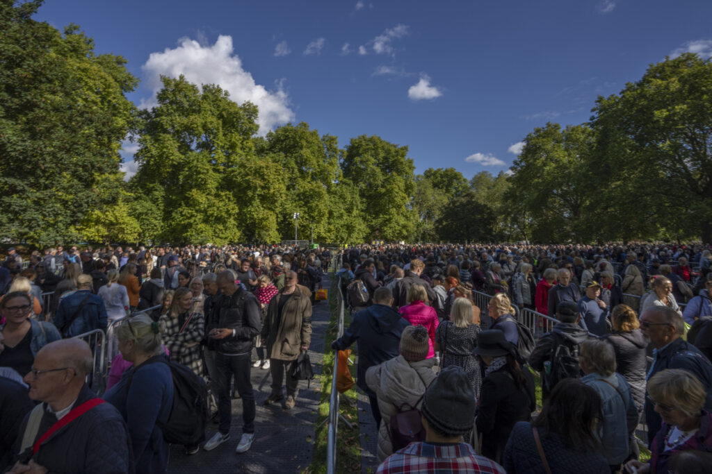 People stand in a queue to pay their respects to the late Queen Elizabeth II during the lying-in-state,, in Southwark park in London, Friday, Sept. 16, 2022. The Queen will lie in state in Westminster Hall for four full days before her funeral on Monday Sept. 19. (AP Photo/Nariman El-Mofty)