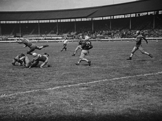 A game of American football at White City stadium, London, between 'Crimson Tide&#039