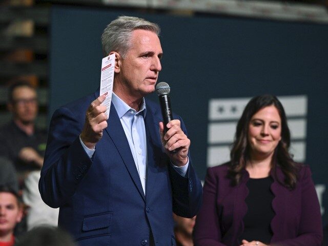 Rep. Elise Stefanik (R-NY), right, listens as House Minority leader Kevin McCarthy (R-CA) speaks at DMI Companies in Monongahela, Pa., Friday, Sept. 23, 2022. McCarthy joined with other House Republicans to unveil their "Commitment to America" agenda. (Barry Reeger/AP)