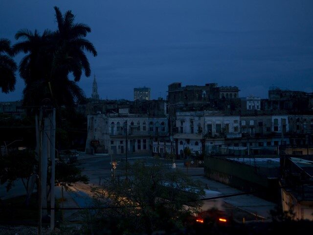 A neighborhood sits dark during a blackout triggered by the passing of Hurricane Ian in Havana, Cuba, early morning Wednesday, Sept. 28, 2022. Hurricane Ian knocked out electricity to the entire island when it hit the island’s western tip as a major storm. (Ismael Francisco/AP)