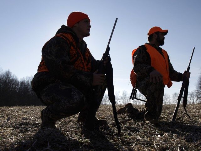 FILE- In this Dec. 3, 2008, file photo, a pair of hunters hunt for deer on Penn State Univ