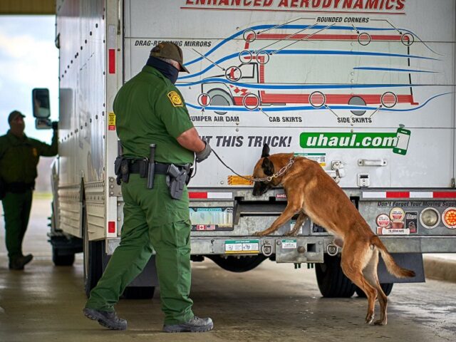 Eagle Pass South Station Border Patrol agents conduct a K-9 search of a U-Haul box truck l