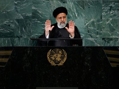 NEW YORK, NEW YORK - SEPTEMBER 21: Iranian President Ebrahim Raisi holds up his hands as h