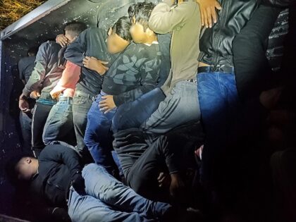 Ten migrants found hiding in bed of pickup truck. (U.S. Border Patrol/Tucson Sector)