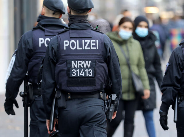 14 December 2020, North Rhine-Westphalia, Cologne: Police officers patrol the sign lane. In order to contain the spreading pandemic, public life throughout Germany will be drastically cut back from next Wednesday (December 16). Photo: Oliver Berg/dpa (Photo by Oliver Berg/picture alliance via Getty Images)