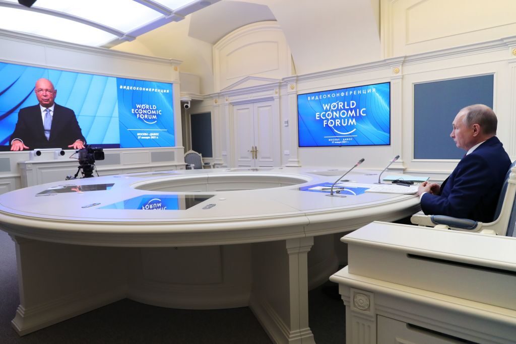 Russian President Vladimir Putin and the WEF's Klaus Schwab speak via a video link on January 27, 2021. (Photo by MIKHAIL KLIMENTYEV/SPUTNIK/AFP via Getty Images)