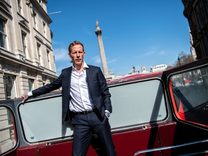Actor and political activist, Laurence Fox, poses for photographs on top a double decker bus near Trafalgar Square