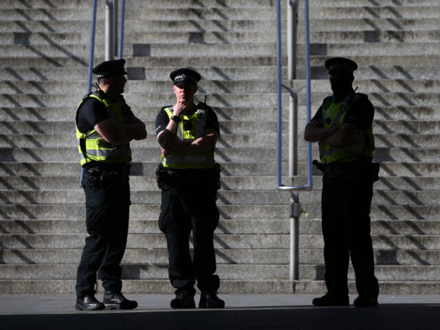 LONDON, ENGLAND - APRIL 18: Met Police officers stand near Wembley Stadium on April 18, 2021 in London, England. 4000 local residents have been permitted to attend the Leicester City vs Southampton match as part of the government's Events Research Programme, which will study how to safely hold major events …