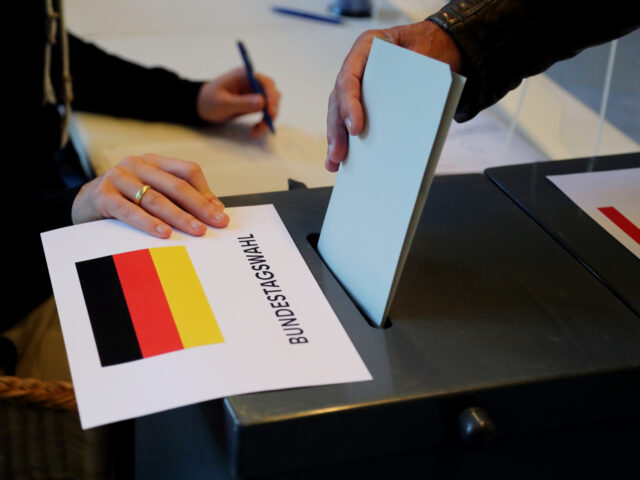 BERLIN, GERMANY - SEPTEMBER 26: A man casts his vote in the German general elections at a