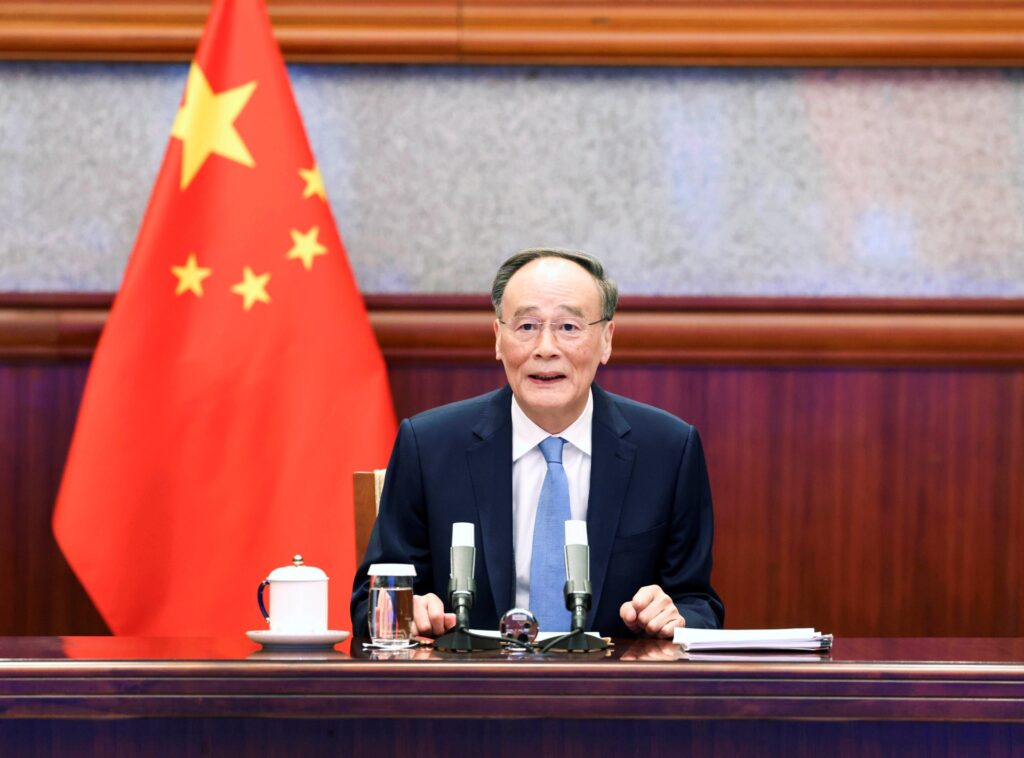 Chinese Vice President Wang Qishan meets with Emmanuel Bonne, diplomatic counselor to French President Emmanuel Macron, via video link in Beijing, capital of China, Jan. 13, 2022. (Photo by Pang Xinglei/Xinhua via Getty Images)