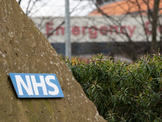 An NHS sign is seen at the Salford Royal Hospital in Manchester, Britain, April 1, 2022. P