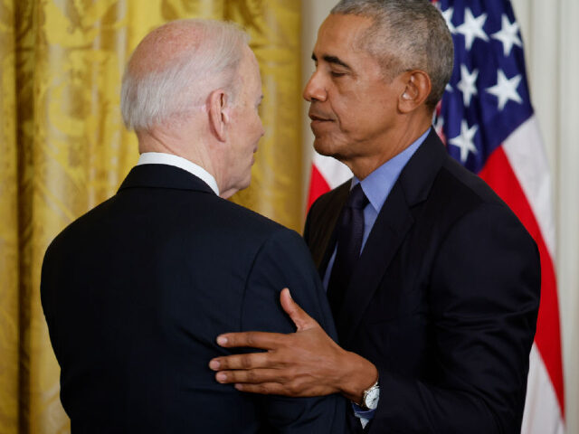 WASHINGTON, DC - APRIL 5: (L-R) U.S. President Joe Biden and former President Barack Obama embrace during an event to mark the 2010 passage of the Affordable Care Act in the East Room of the White House on April 5, 2022 in Washington, DC. With then-Vice President Joe Biden by …