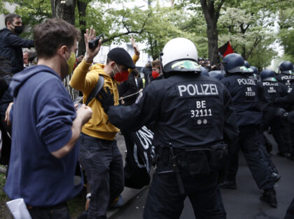 BERLIN, GERMANY - MAY 01: Riot police confront people marching in the annual "Revolutionary May 1" demonstration on May 1, 2022 in Berlin, Germany. May Day in Berlin is being celebrated with a variety of events, including a gathering hosted by labor unions, anti-war protests, community street fairs and an …