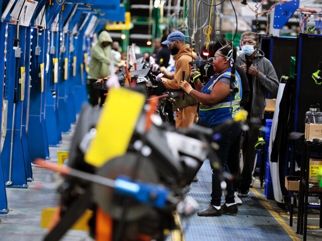 Employees work on the assembly line at the Dakkota Integrated Systems manufacturing facility in Detroit, Michigan, U.S., on Thursday, May 5, 2022. Dakkota Integrated Systems is a Native American, Woman-Owned Company that manufactures Instrument Panels For Stellantis Jeep Assembly Plants. Photographer: Jeff Kowalsky/Bloomberg