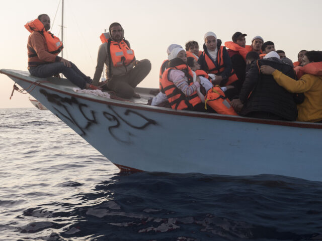 ITALY - 2022/05/18: Women seen on board of a migrant boat in distress. The crew of Astral sailboat, of the Spanish NGO Open Arms, carried out a rescue for nearly 70 women and men in Italian Sar Zone. The Italian Coast Guard (Guardia Costiera Italiana) arrived to take people on …