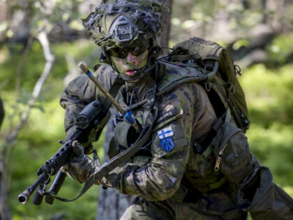 VÄRMDÖ, SWEDEN - JUNE 11: Finnish soldiers perform war simulation exercises during the