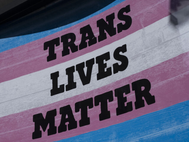 Transgender Pride flag with the slogan 'Trans Lives Matter' in Soho on 28th June 2022 in L