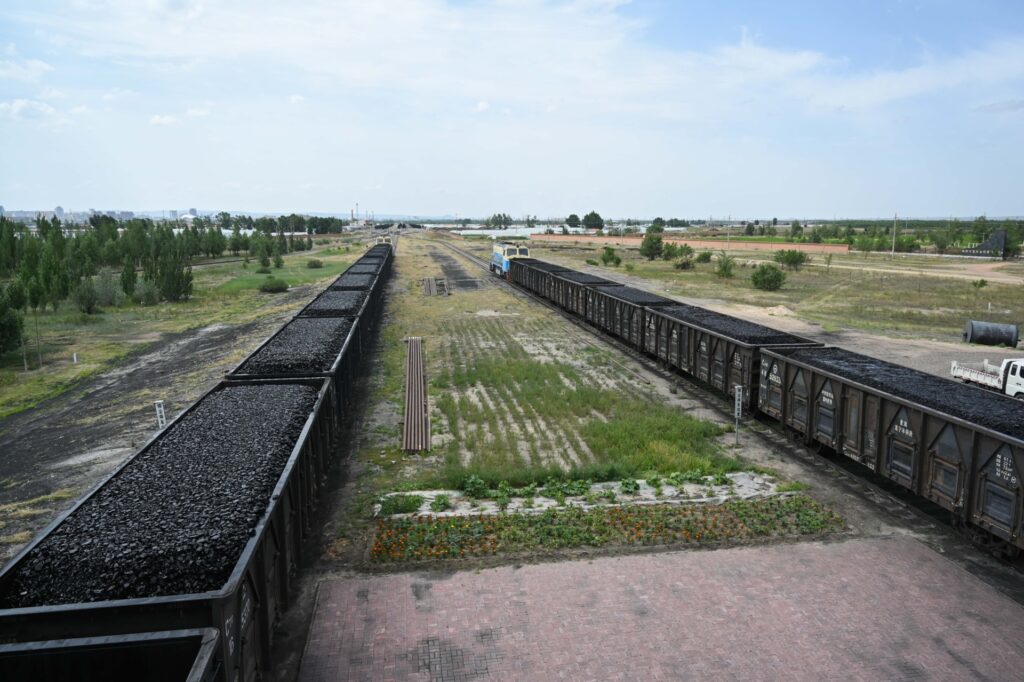XILINGOL, CHINA - JULY 12, 2022 - A train loaded with coal gallops on the xilingol grassland in Inner Mongolia, China, July 12, 2022. (Photo credit should read CFOTO/Future Publishing via Getty Images)