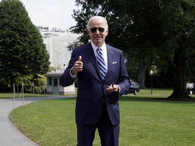 US President Joe Biden gives a thumbs up to the members of the media on the South Lawn of