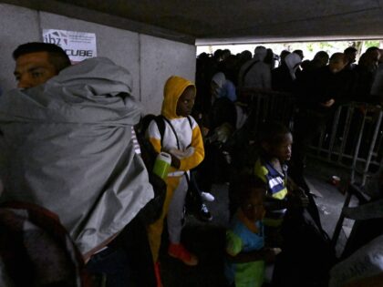 Asylum seekers wait outside the headquarters of the Fedasil Federal Agency For The Reception Of Asylum Seekers in Brussels, where the registration of asylum seekers will happen from today onwards, Monday 29 August 2022. The Fedasil reception center Klein Kasteeltje - Petit Chateau has been over capacity for weeks, resulting …