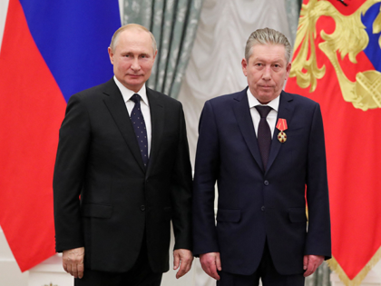 Russia's President Vladimir Putin (L) and Chairman of the Board of Directors of Oil Company Lukoil Ravil Maganov (R) pose for a photo during an awarding ceremony at the Kremlin in Moscow on November 21, 2019. - Russian oil producer Lukoil said on September 1, 2022 its chairman Ravil Maganov …