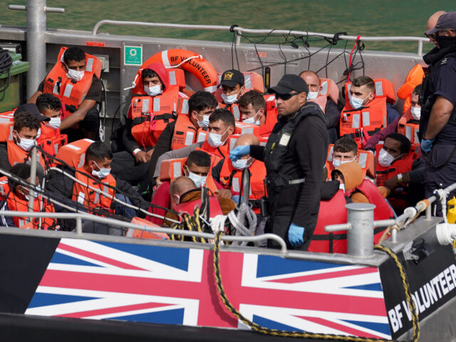 A group of people thought to be migrants, are brought in to Dover, Kent, onboard a Border