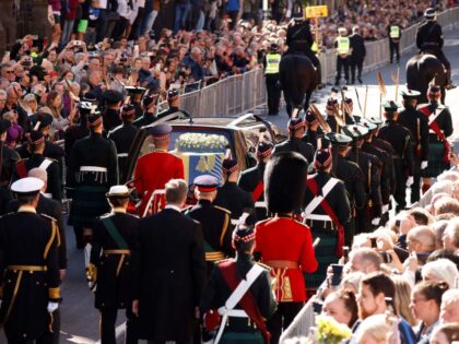 Britain's Prince Andrew, Duke of York, Britain's Princess Anne, Princess Royal and Britain's King Charles III (obscured) walk behind the procession of Queen Elizabeth II's coffin, from the Palace of Holyroodhouse to St Giles Cathedral, on the Royal Mile on September 12, 2022, where Queen Elizabeth II will lie at …