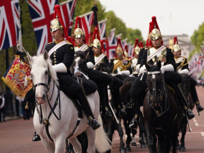 LONDON, ENGLAND - SEPTEMBER 14: Soldiers of the Household Cavalry ride along The Mall on September 14, 2022 in London, United Kingdom. Queen Elizabeth II's coffin is taken in procession on a Gun Carriage of The King's Troop Royal Horse Artillery from Buckingham Palace to Westminster Hall where she will …