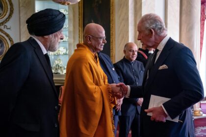 Britain's King Charles III meets with faith leaders during a reception at Buckingham Palac