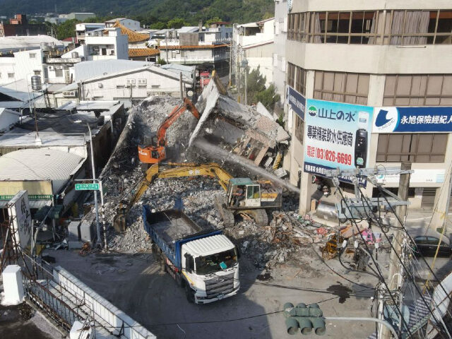 An aerial view shows workers taking down a collapsed building in eastern Taiwan's Hualien