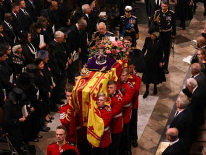 TOPSHOT - Britain's King Charles III, Britain's Camilla, Queen Consort, Britain's Princess Anne, Princess Royal, Britain's Prince Edward, Earl of Wessex and Britain's Prince Andrew, Duke of York follow the Bearer Party of The Queen's Company, 1st Battalion Grenadier Guards as they carry the coffin of Queen Elizabeth II, draped …