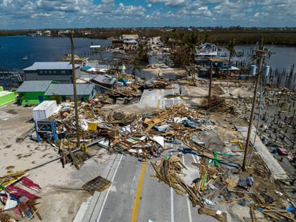 An aerial picture taken on October 1, 2022 shows a broken section of the Pine Island Road, debris and destroyed houses in the aftermath of Hurricane Ian in Matlacha, Florida on October 1, 2022. - Shocked Florida communities counted their dead October 1, 2022, as the full scale of the …
