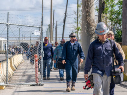 TEXAS CITY, TEXAS - MAY 10: Workers exit the Marathon Galveston Bay Refinery on May 10, 2022 in Texas City, Texas. Texas added approximately 4,000 oil field service jobs in April, but throughout the country employment around the oil sector remains below pre-pandemic levels. Companies continue competing for workers in …