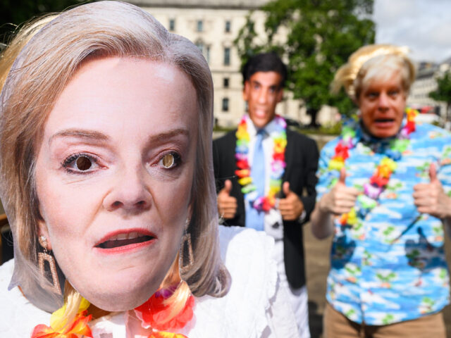 LONDON, ENGLAND - AUGUST 25: People wearing masks featuring Britain's Prime Minister Boris