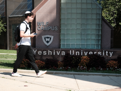 People walk by the campus of Yeshiva University in New York City on August 30, 2022 in New York City. Yeshiva University on Monday filed an emergency request with the Supreme Court asking it to block a judge’s order that requires the university to recognize an LGBTQ+ student group. The …