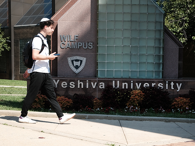 People walk by the campus of Yeshiva University in New York City on August 30, 2022 in New