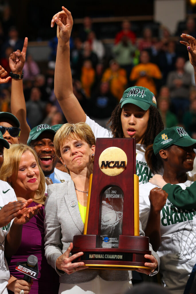 DENVER, CO - APRIL 03: Head coach Kim Mulkey and Brittney Griner #42 of the Baylor Bears celebrate with the National Championship trophy after they won 80-61 against the Notre Dame Fighting Irish during the National Final game of the 2012 NCAA Division I Women's Basketball Championship at Pepsi Center on April 3, 2012 in Denver, Colorado. (Photo by Doug Pensinger/Getty Images)