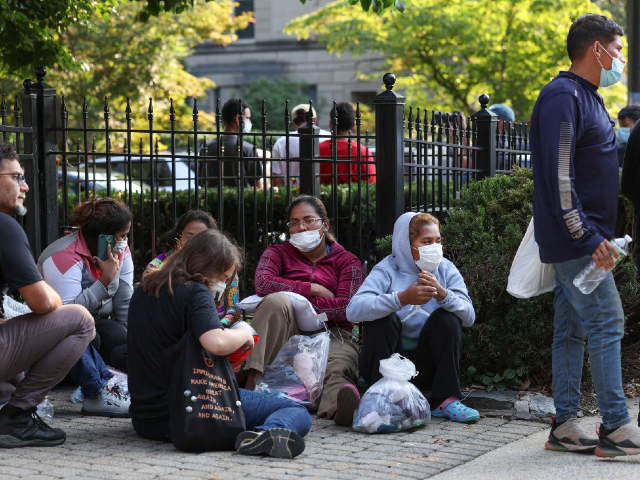 WASHINGTON, DC - SEPTEMBER 15: Migrants from Central and South America wait near the residence of US Vice President Kamala Harris after being dropped off on September 15, 2022 in Washington, DC. Texas Governor Greg Abbott dispatched buses carrying migrants from the southern border to Harris' home early Thursday morning. (Photo by Kevin Dietsch/Getty Images)