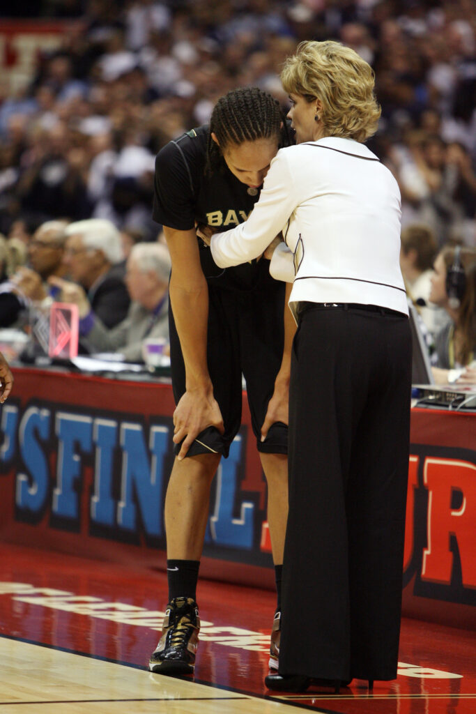04 APR 2010: Head Coach Kim Mulkey of Baylor University consoles Brittney Griner (42) in the closing seconds of their loss to the University of Connecticut during the Division I Women's Basketball Semifinals held at the Alamodome during the 2010 Women's Final Four in San Antonio, TX. Connecticut defeated Baylor 70-50 to advance to the finals. Rodolfo Gonzalez/NCAA Photos via Getty Images