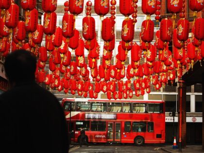 LONDON - FEBRUARY 05: Lanterns are seen hanging as traffic makes its way past China Town a