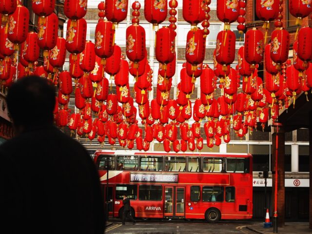 LONDON - FEBRUARY 05: Lanterns are seen hanging as traffic makes its way past China Town a day before Chinese new years eve as lanterns are seen hanging on February 5, 2008 in London, England. In Chinese culture, 2008 is the Year of the Rat, which is also known by …