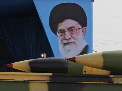 An Iranian military truck carries surface-to-air missiles past a portrait of Iran's Supreme Leader Ayatollah Ali Khamenei during a parade on the occasion of the country's annual army day on April 18, 2018, in Tehran. - President Hassan Rouhani said that Iran "does not intend any aggression" against its neighbours …