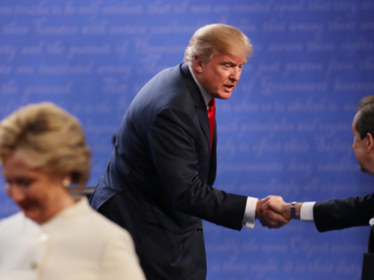 LAS VEGAS, NV - OCTOBER 19: Republican presidential nominee Donald Trump shakes hands with Fox News anchor and moderator Chris Wallace as Democratic presidential nominee former Secretary of State Hillary Clinton walks off stage after the third U.S. presidential debate at the Thomas & Mack Center on October 19, 2016 …