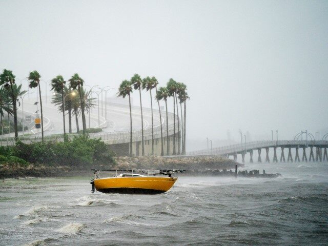 SARASOTA, FL - SEPTEMBER 28: A sail boat is beached at Sarasota Bay as Hurricane Ian appro