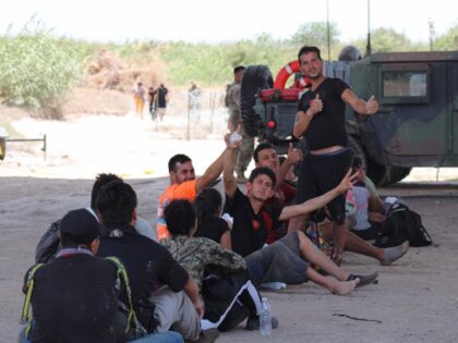 A group of mostly Venezuelan migrants is detained by Texas National Guard members until Border Patrol can arrive. (Randy Clark/Breitbart Texas, File)