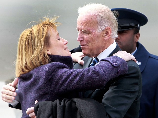New Hampshire Gov. Maggie Hassan greets Vice President Joe Biden as he arrives at the Manchester Airport, Tuesday, March 25, 2014, in Manchester, N.H. Biden is making the rounds in this key political state critical to the Democrats' hopes of holding onto the Senate majority_and perhaps to Biden's own presidential ambitions in 2016. (AP Photo/Jim Cole)