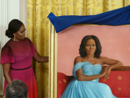 Former US First Lady Michelle Obama participates in a ceremony to unveil her official Whit