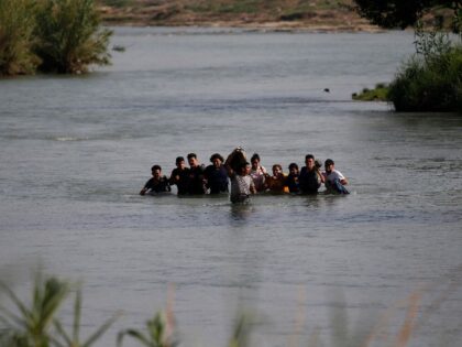 Migrants, mostly from Nicaragua, cross the Rio Grande River into the U.S., in Eagle Pass, Texas, Friday, May 20, 2022. The Eagle Pass area has become an increasingly popular crossing corridor for migrants, especially those from outside Mexico and Central America, under Title 42 authority, which expels migrants without a …