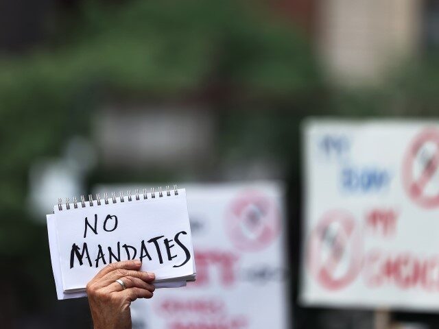 People gather at City Hall to protest vaccine mandates on August 09, 2021 in New York City