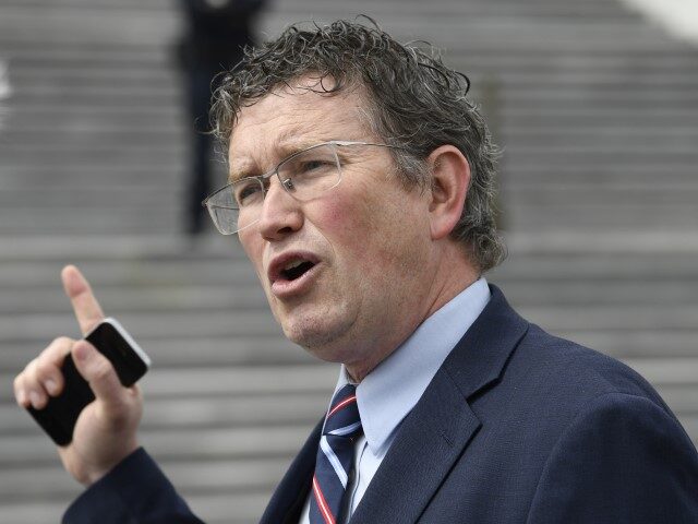 FILE - Rep. Thomas Massie (R-KY) talks to reporters before leaving Capitol Hill in Washington, Friday, March 27, 2020, after attempting to slow action on a rescue package. Massie, who has been critical of pandemic mask and vaccine mandates said he has tested positive for COVID-19, Thursday, Jan. 20, 2022. …